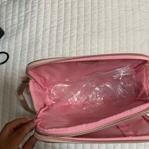 Cute juicy couture  makeup bag for travel comes with one bottle that says juicy